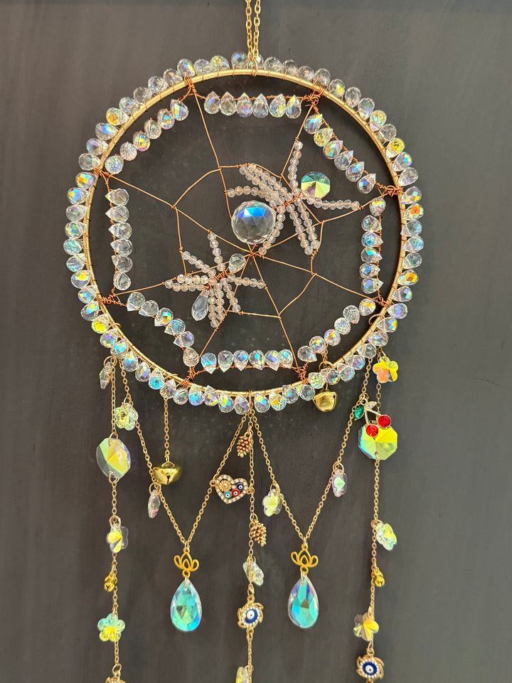 Close-up of spider crystal sun catcher with detailed crystal beads and charms