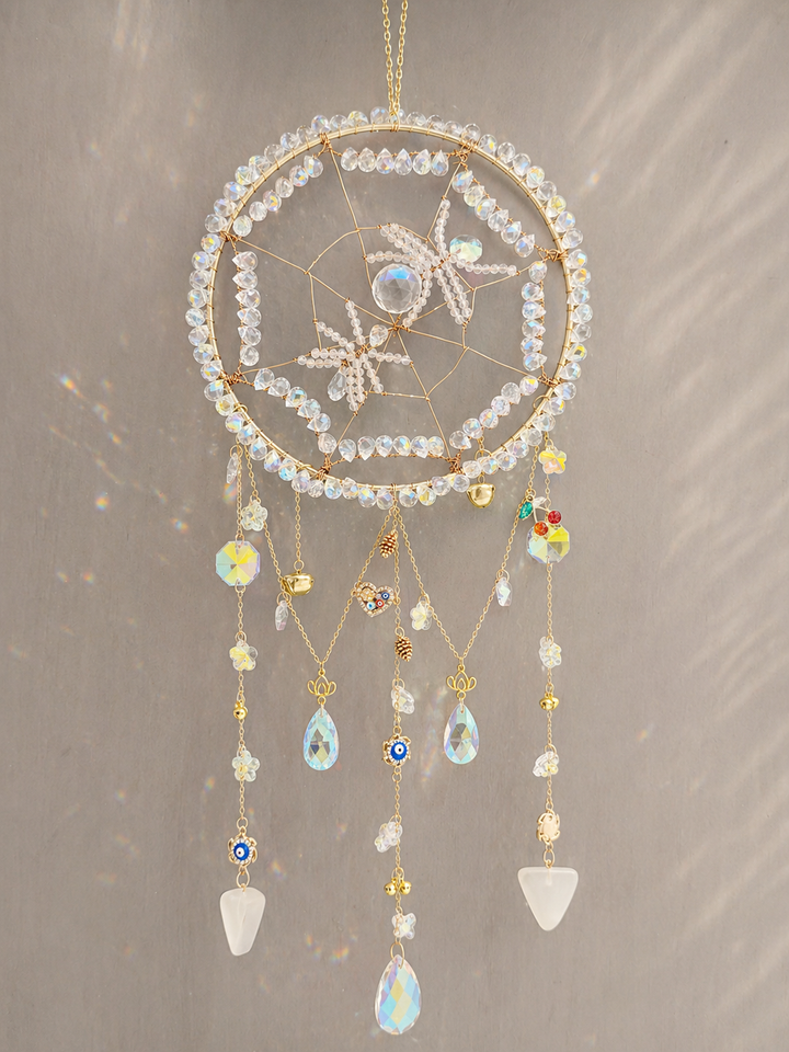 Crystal spider sun catcher hanging as spiritual wall décor in a window
