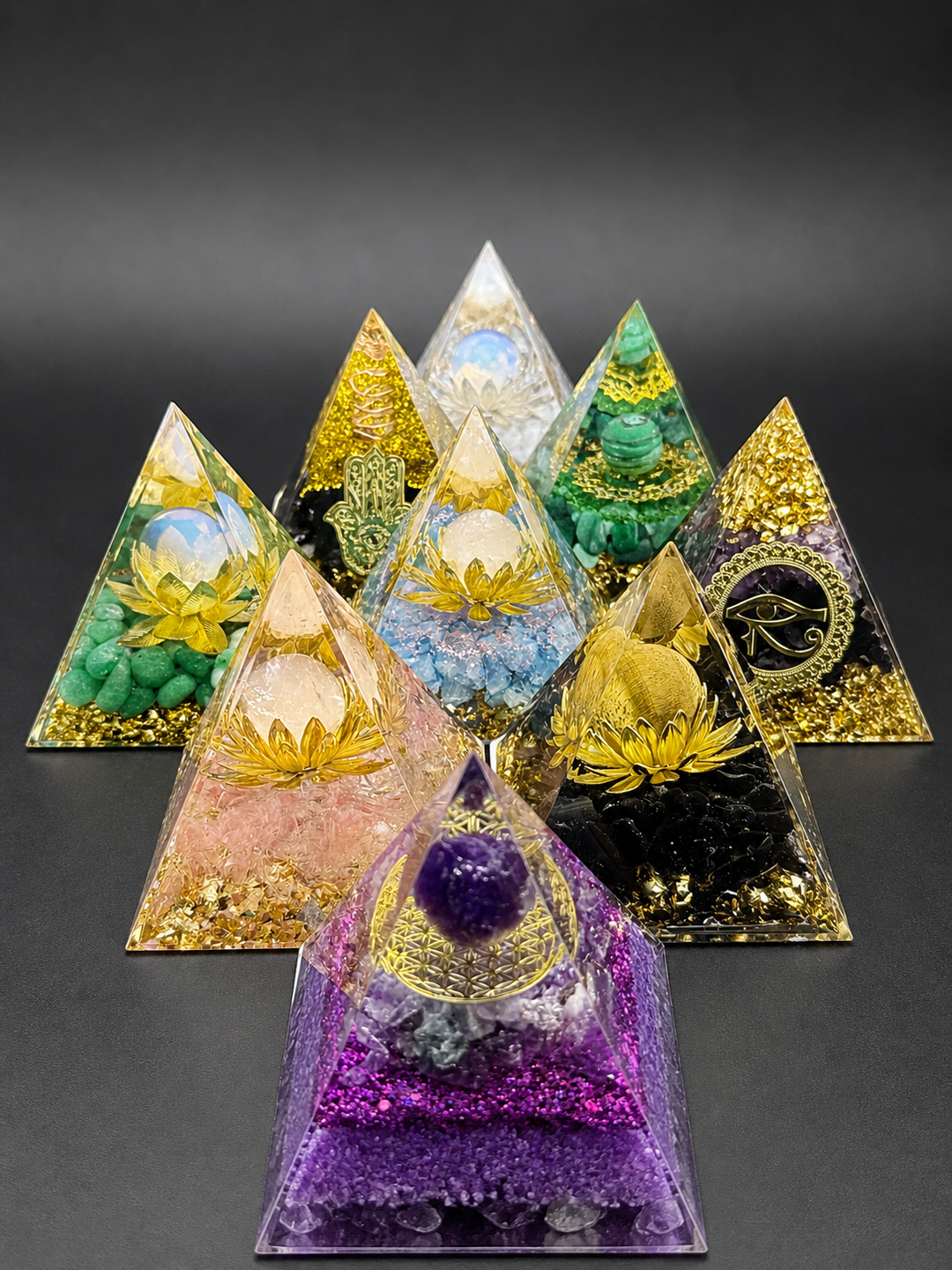 Orgone pyramids with different crystals for energy protection and chakra balance