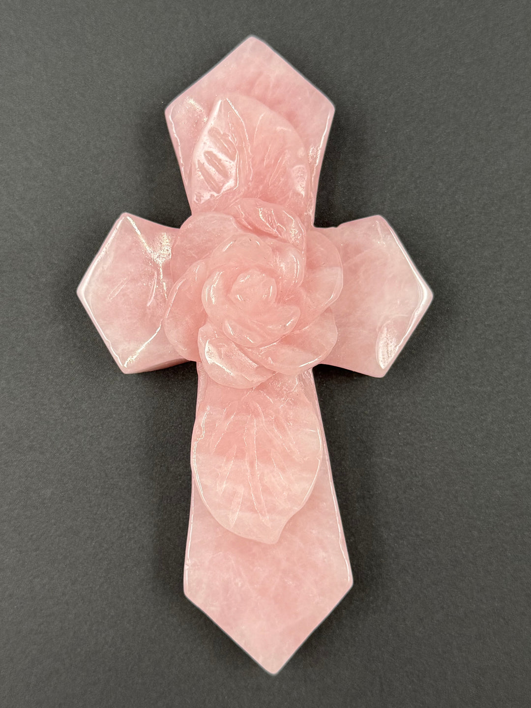 Natural pink rose quartz Sacred Love Cross featuring a dimensional rose design and soft blush crystal tones, ideal for spiritual home décor.