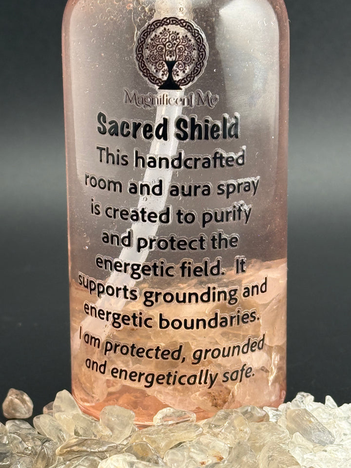 Close-up of Sacred Shield Room & Aura Spray by Magnificent Me featuring a protection affirmation and crystal-infused formula for grounding and energetic safety.